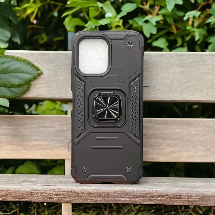 A rugged black Xiaomi Redmi 12 smartphone case with a kickstand on a wooden surface against a backdrop of green foliage.