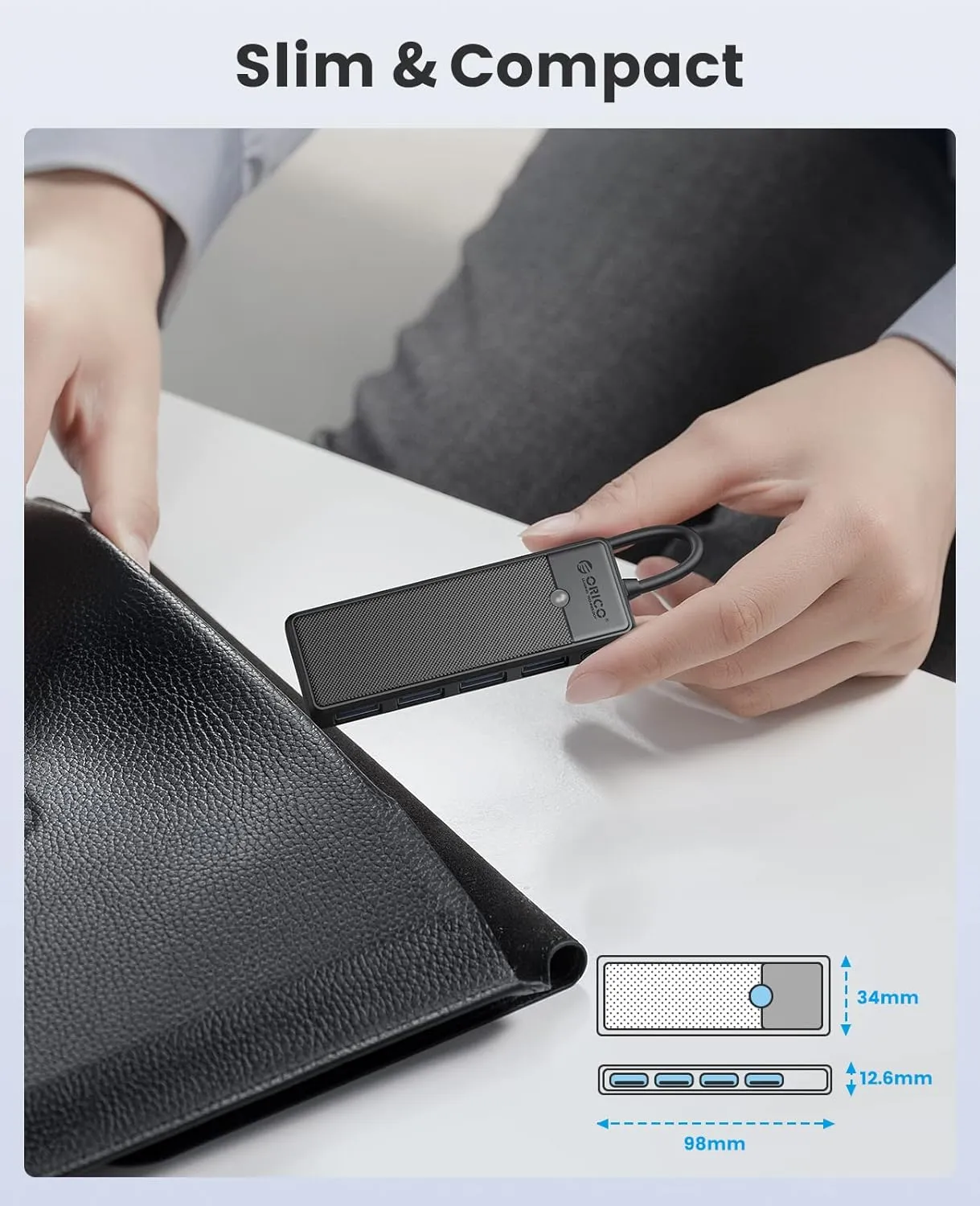 Four USB ports illuminated with blue LED lights on the ORICO hub.