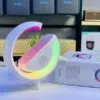 G-shaped RGB light table lamp with customizable colors.