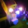 Mushroom LED night light with flower design in a baby room.